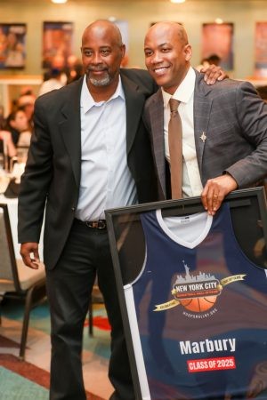 Kenny Anderson with Stephon Marbury, who holds his framed Class of 2025 jersey