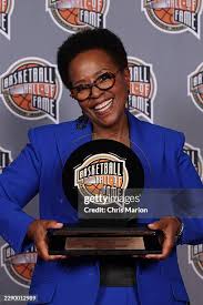 Leah Wilcox holding her Hall of Fame award